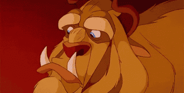 The Beast from Beauty and the Beast looking upset and then smiling with a full row of sharp teeth