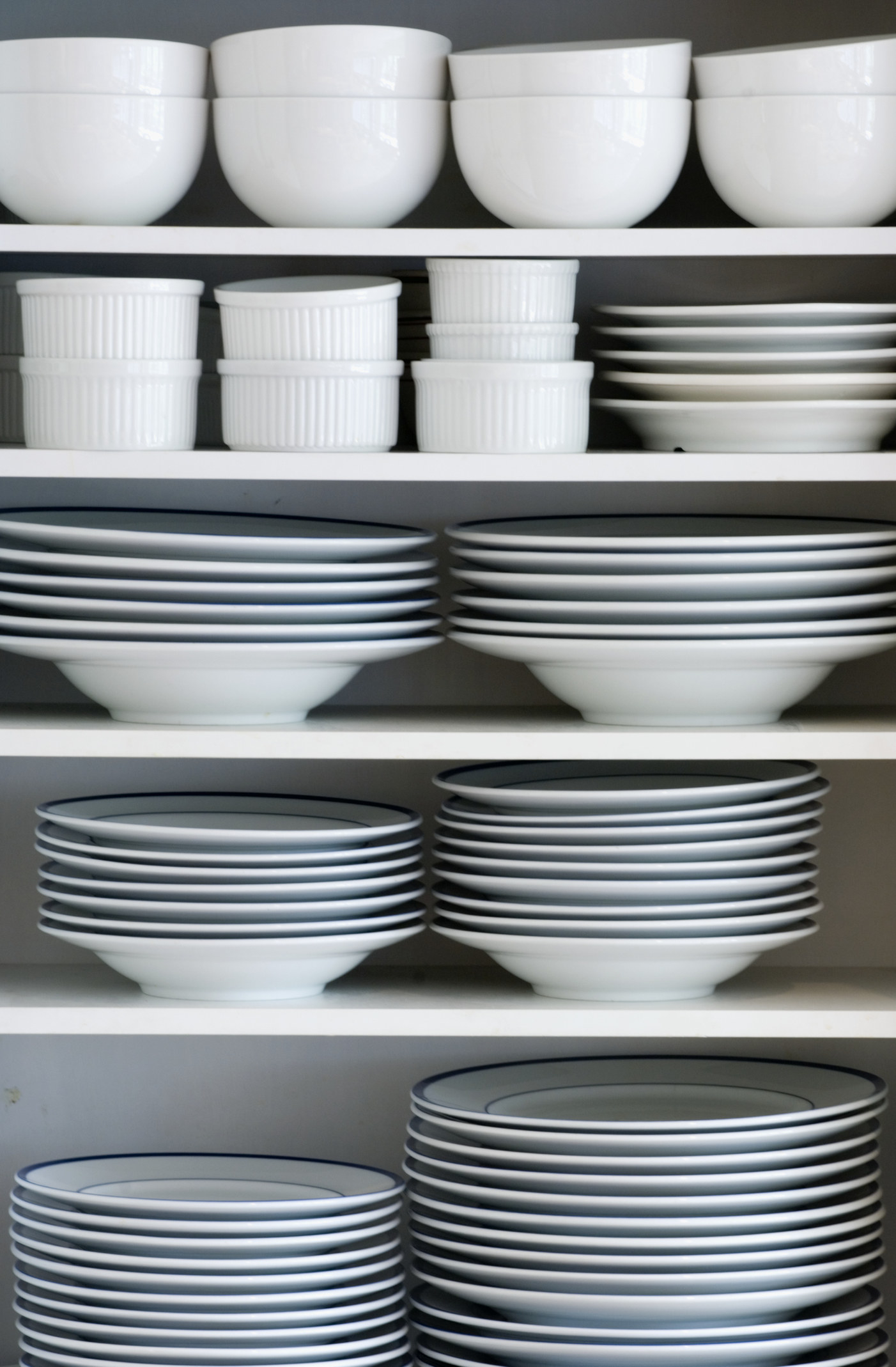 Shelves of white dishes