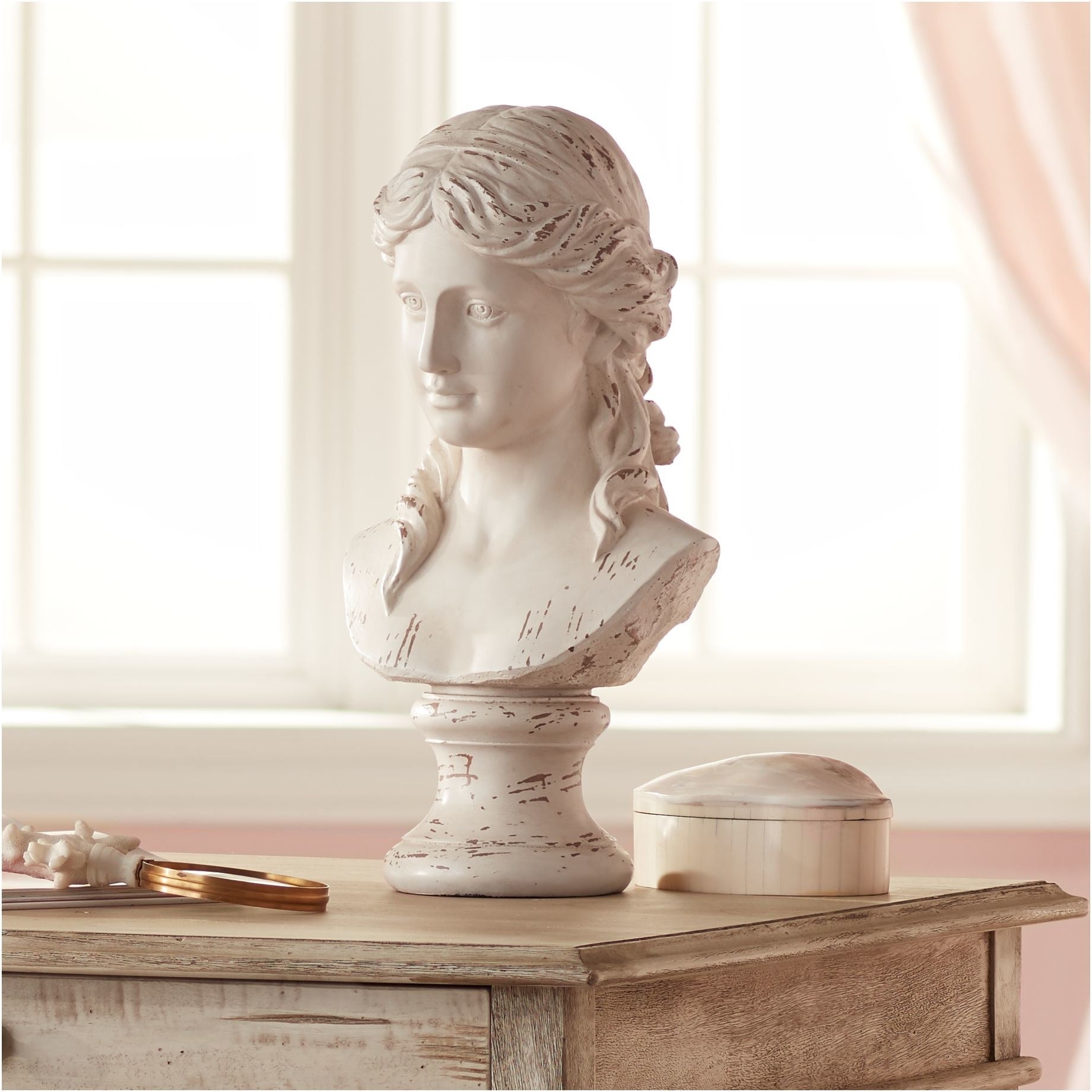 An image of a white Grecian bust sculpture that is 17 1/2-inches high, 9 1/2-inches wide, and 8 1/2-inches deep