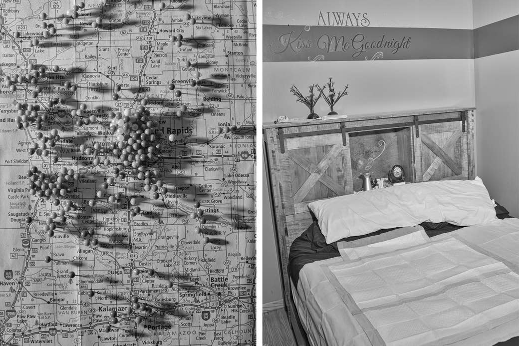 A map full of pins and a bed with papers on it