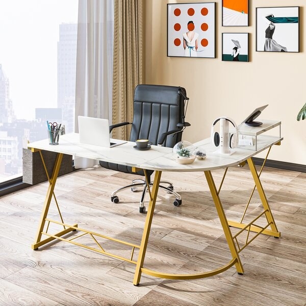 the spacious white and gold L-shaped corner desk