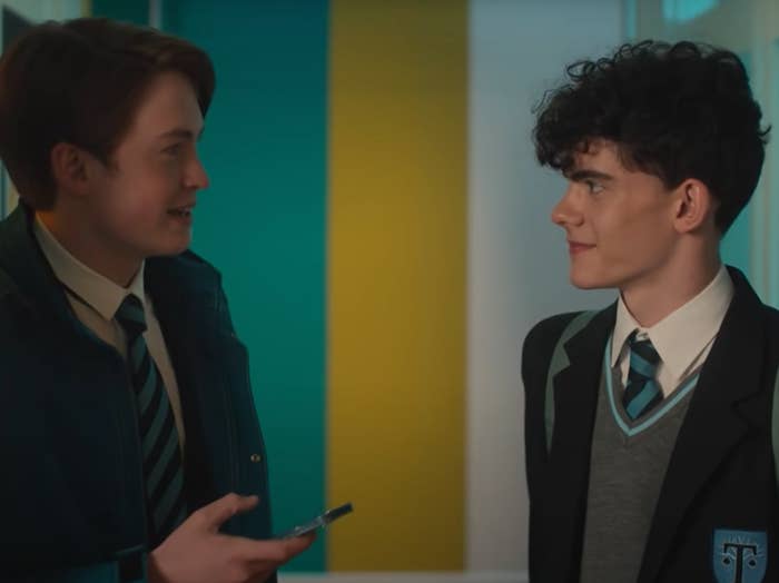 Nick and Charlie smile at each other as they enter their classroom
