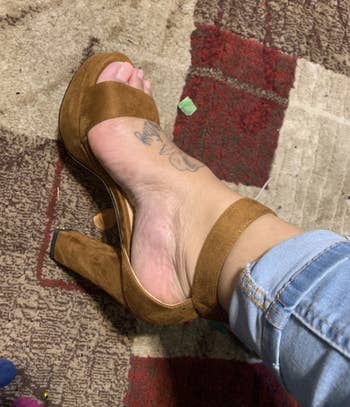 reviewer wearing the brown heel
