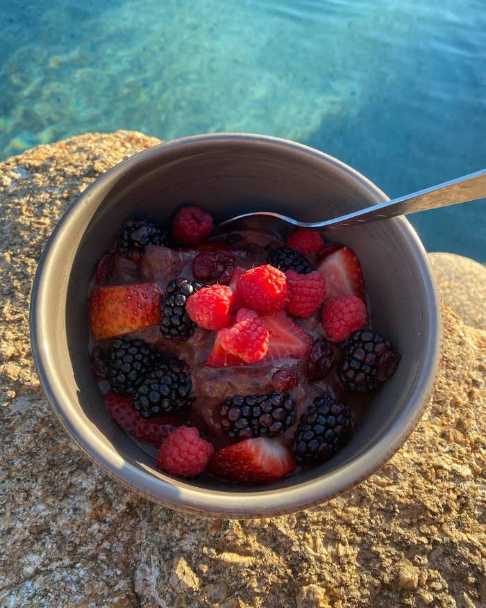 A bowl with berries on top