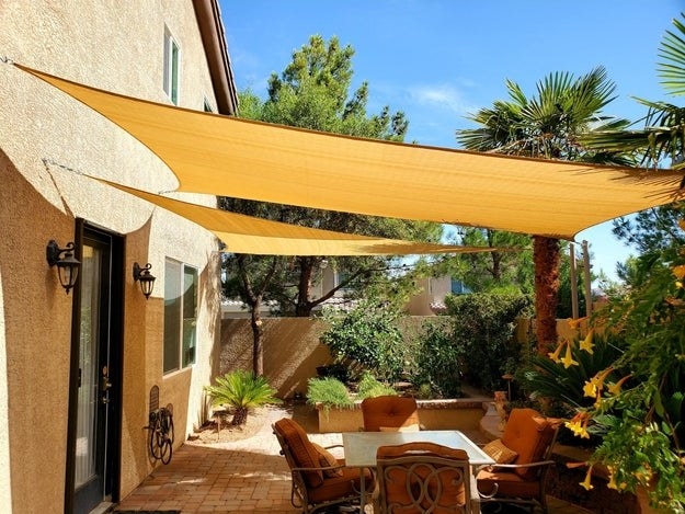 sunshade triangles hung over a seating area to block the sun