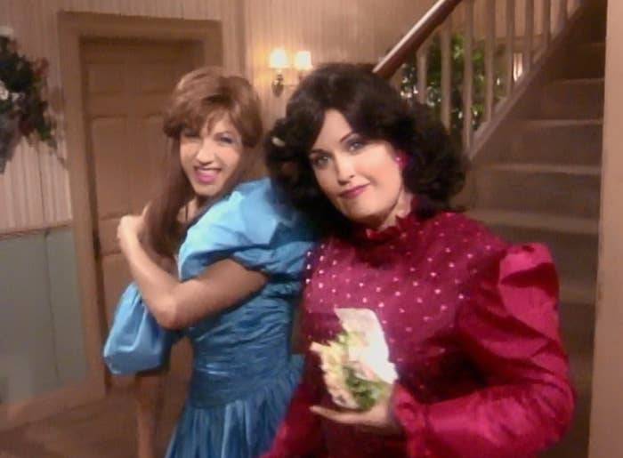 Rachel Green wears a puffy brightly colored dress and Monica Geller wears a velvet dress with sparkles on it