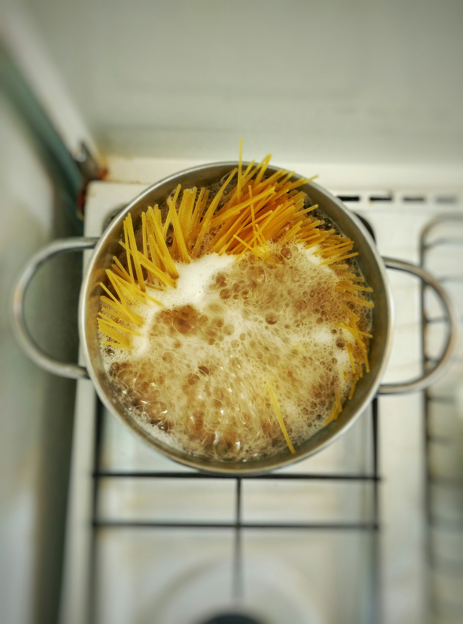 Spaghetti boiling in a pot of water