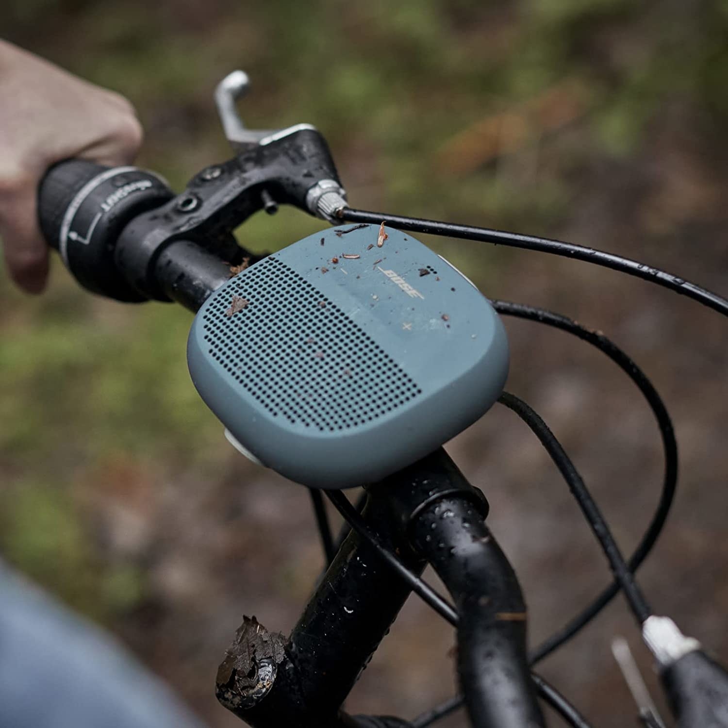 A small speaker mounted to a bike handle