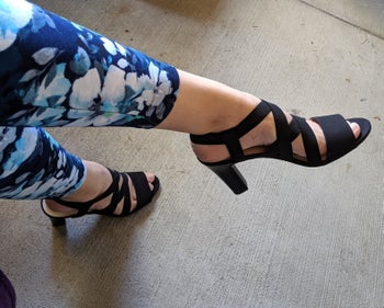 reviewer wearing the strappy elastic heels