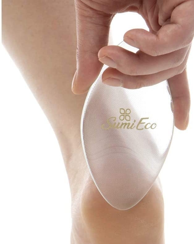 A person using the foot file on their heel