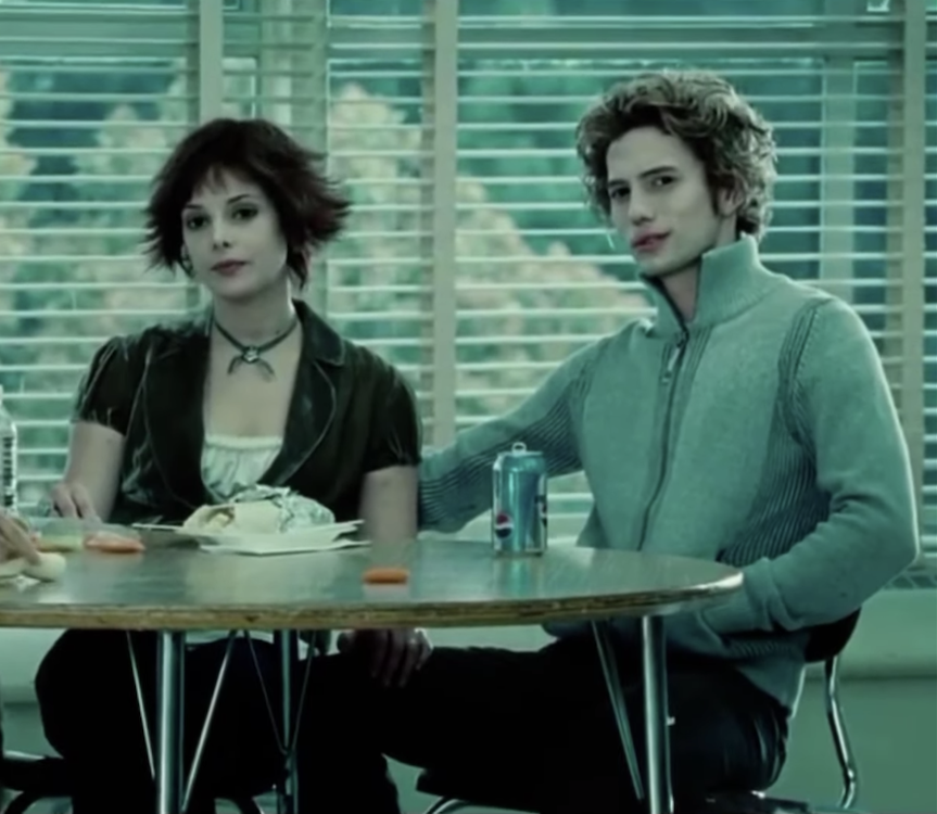 the two characters sitting in the school cafeteria