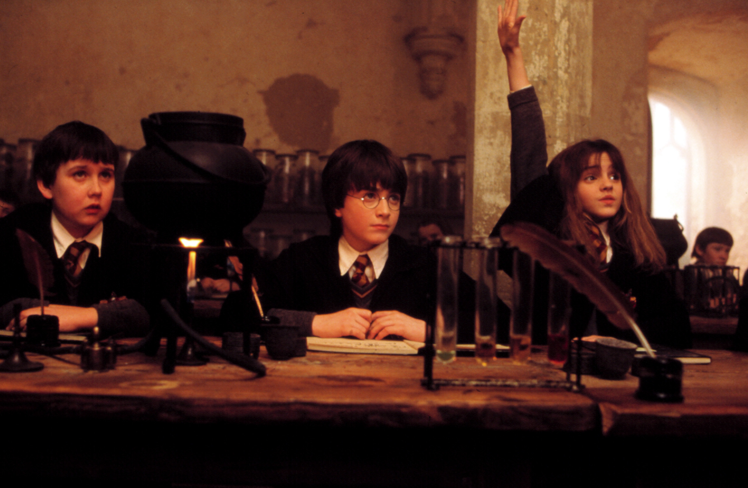 in an early harry potter movie, Hermione raises her hand in class
