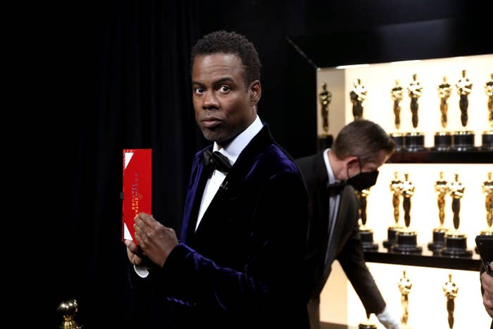 Chris holds an Oscars envelope