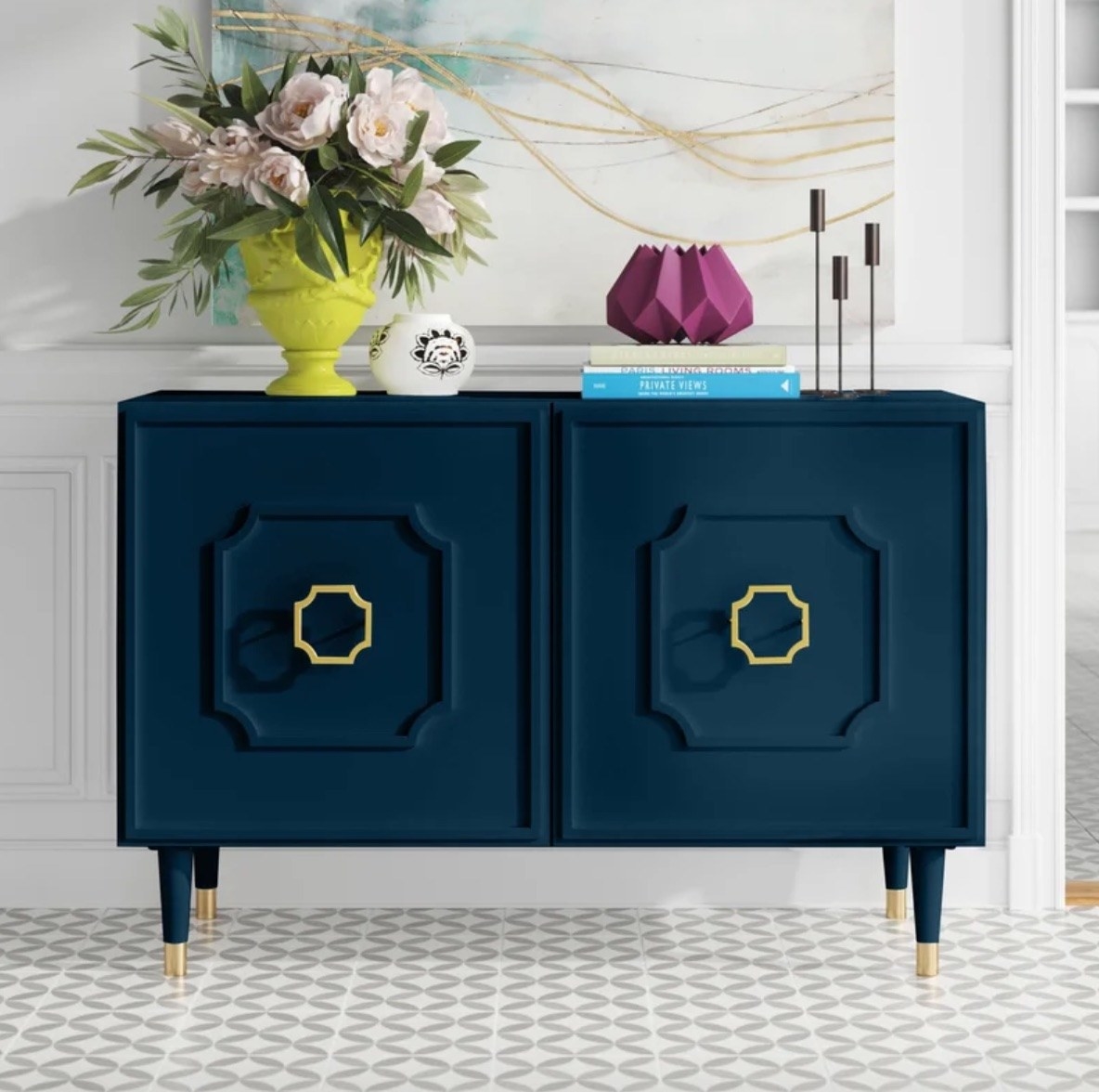 a teal side board with gold accents staged in a hallway