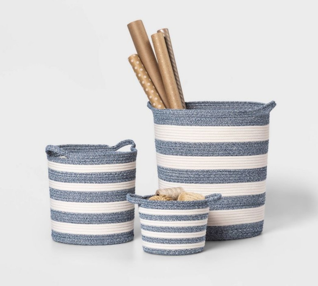 three blue and white striped coiled rope basket