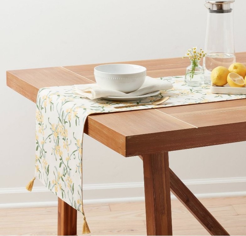 A yellow floral table runner