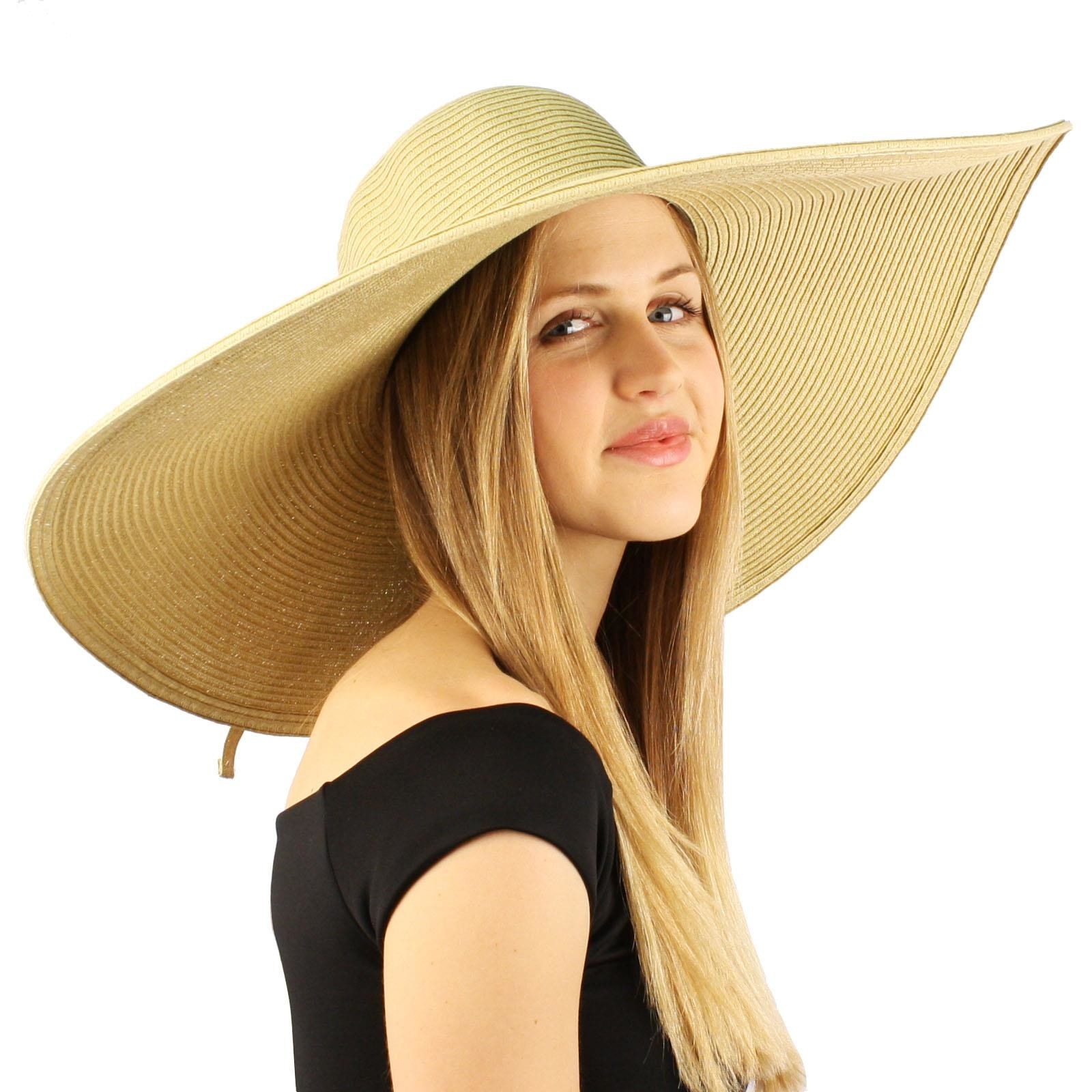 model in a wide light colored floppy hat