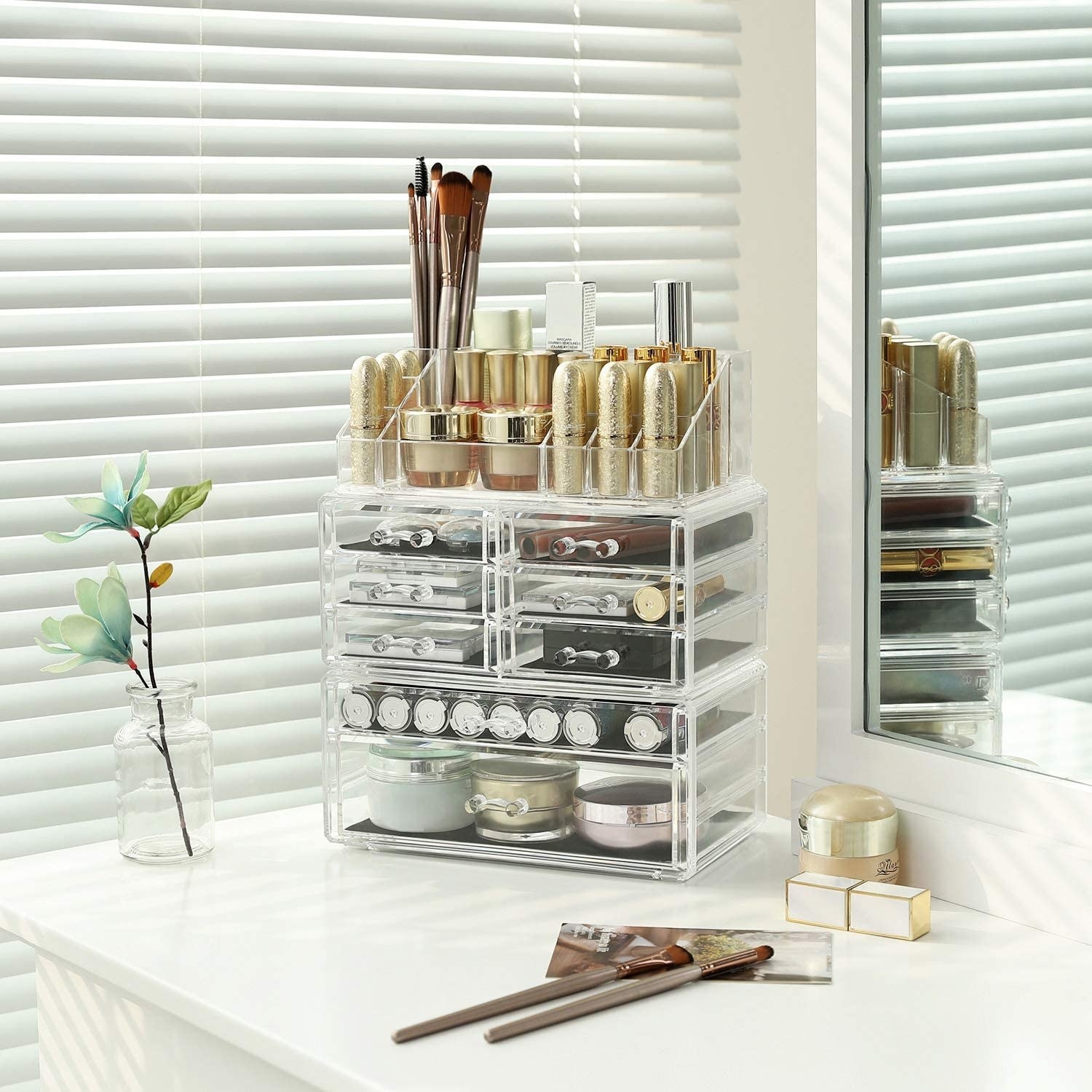 Several products inside the display on a vanity