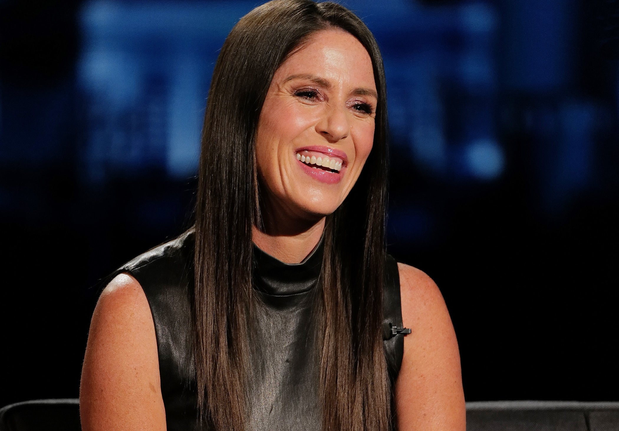 Soleil Moon Frye smiles while seated on stage.