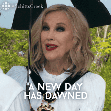 a gif of catherine o&#x27;hara from schitt&#x27;s creek saying a new day has dawned