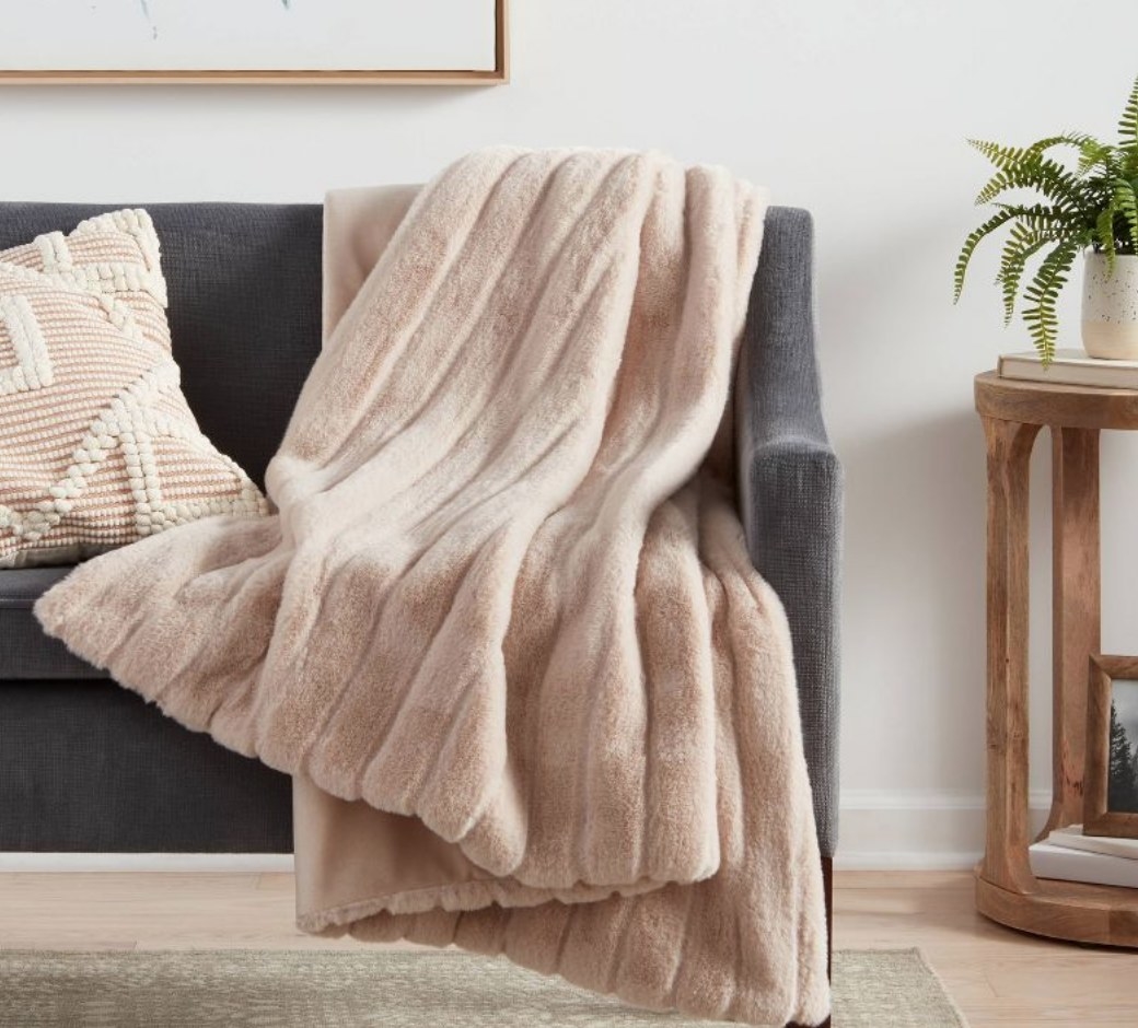 A taupe faux fur throw blanket