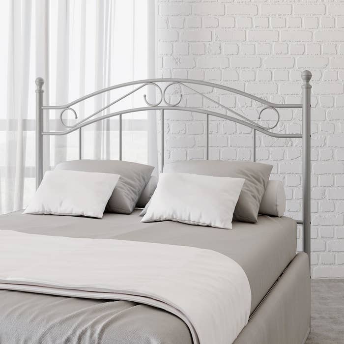 An image of a queen metal headboard in a pewter color