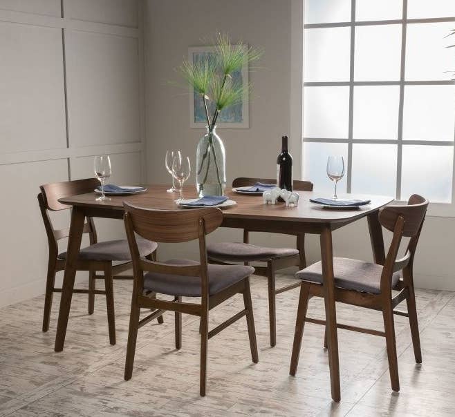 the dining set with gray seat cushions