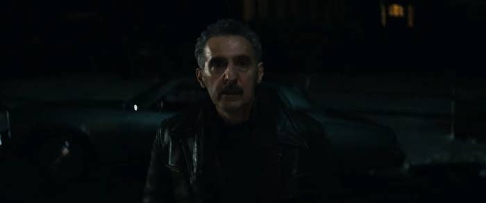Irving standing outside of Burt's house in "Severance"
