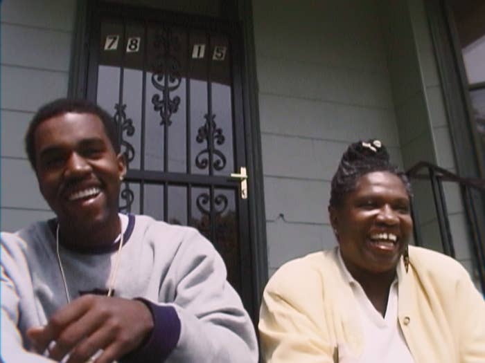 kanye and his mom sit on a stoop of an old house in chicago