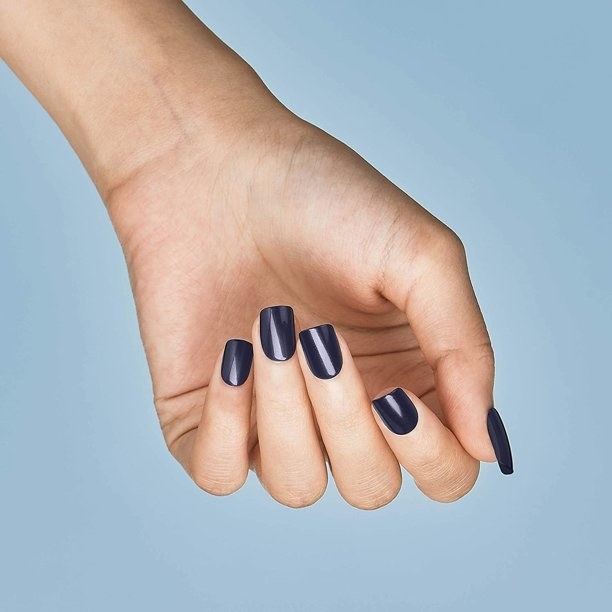 Hand model showing gray nails