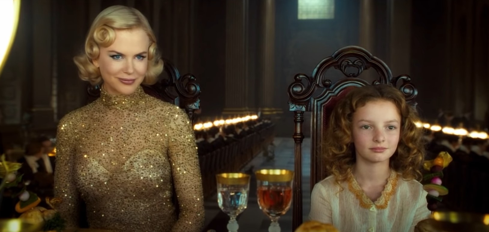 Nicole Kidman and Dakota Blue Richards at a dining table in The Golden Compass