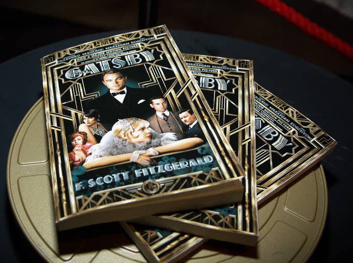Three copies of the book The Great Gatsby with covers featuring the movie&#x27;s stars