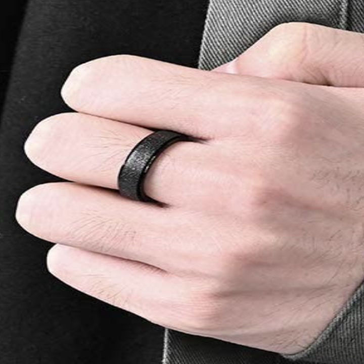 Someone wearing a different spinning ring with a glittery design