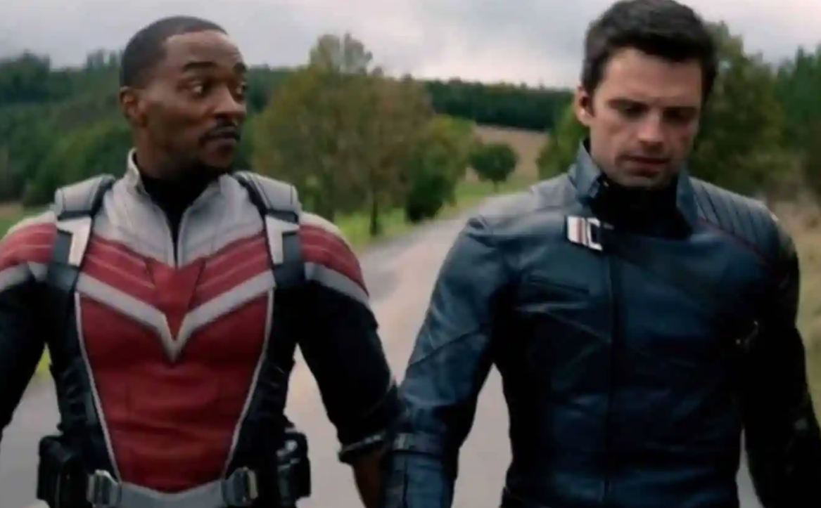 Sam Wilson walks side by side with Bucky Barnes as they go down a deserted street