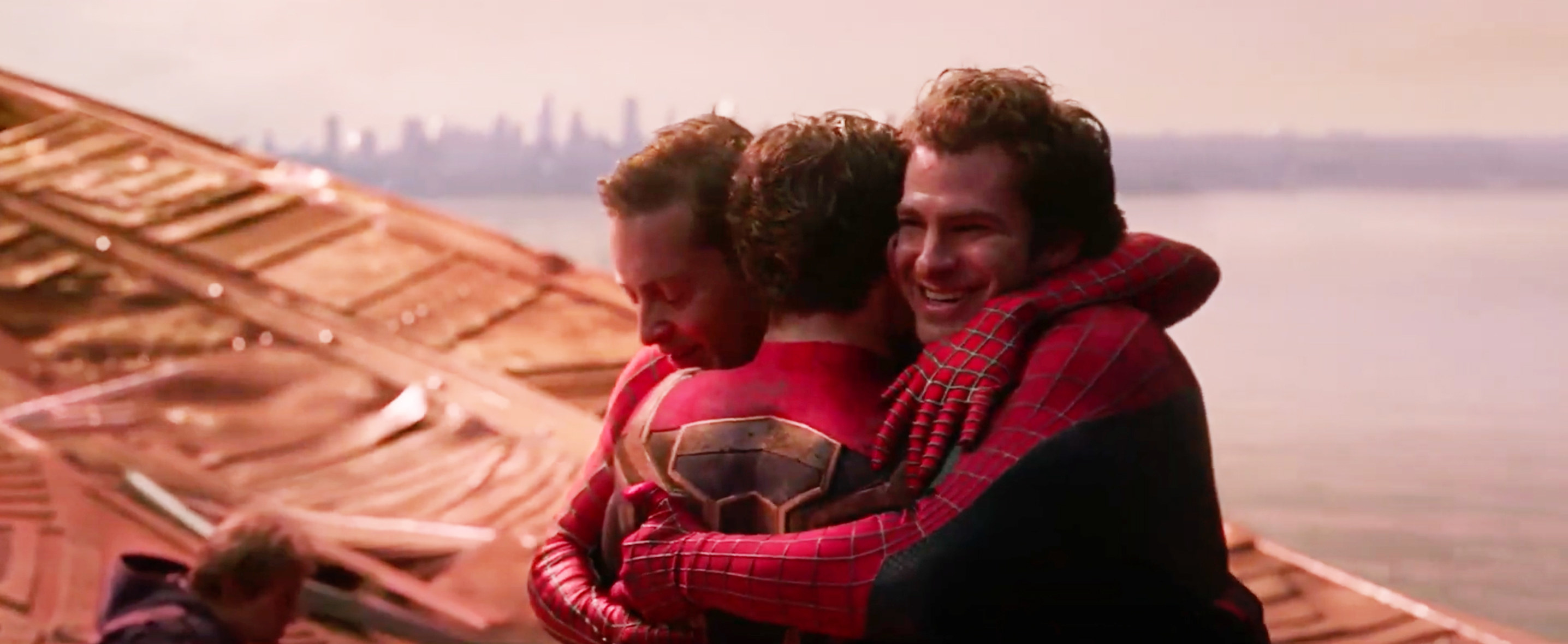 Tobey Maguire and Andrew Garfield hug Tom Holland