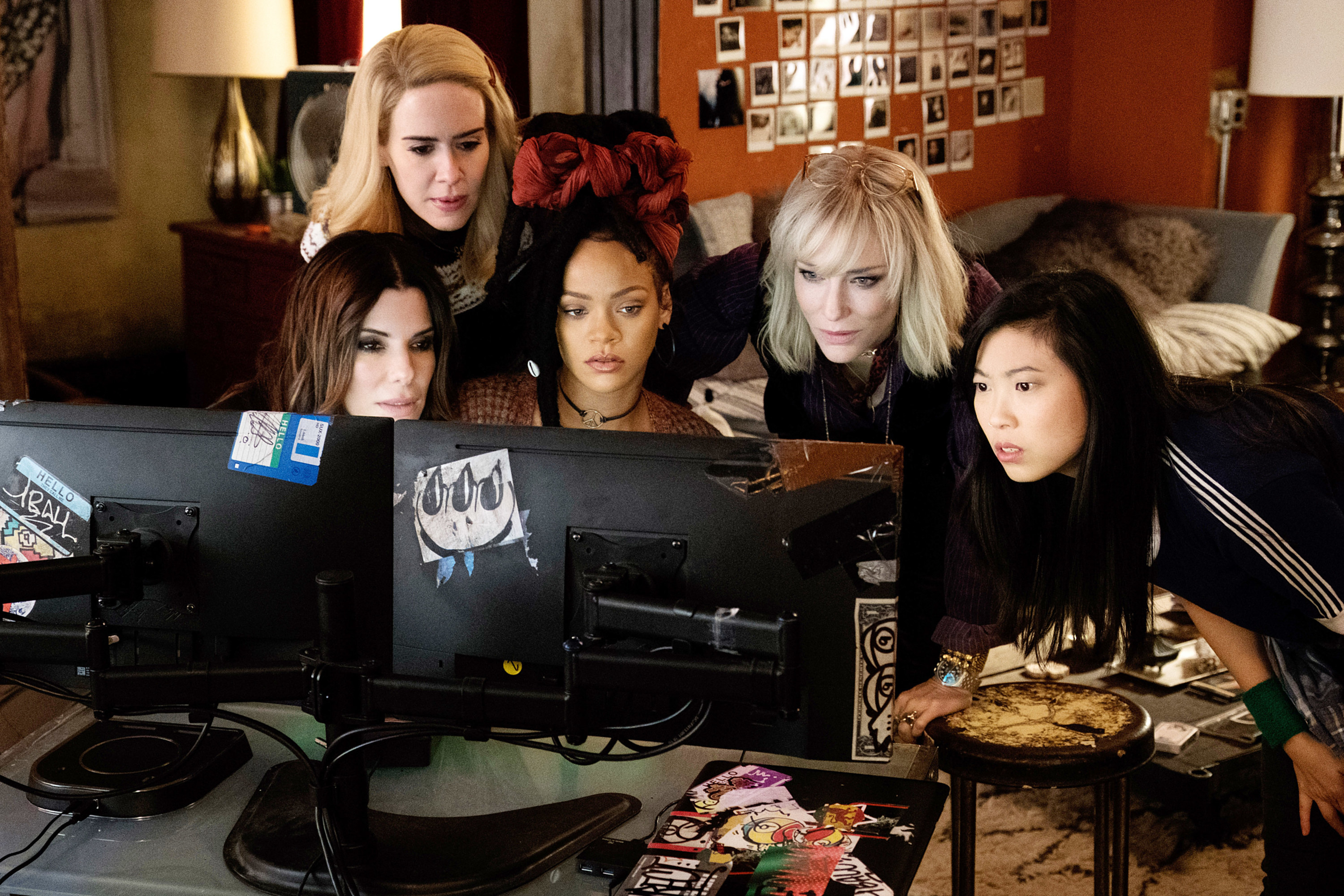Debbie Ocean and her all girl team sit in front of a computer monitor