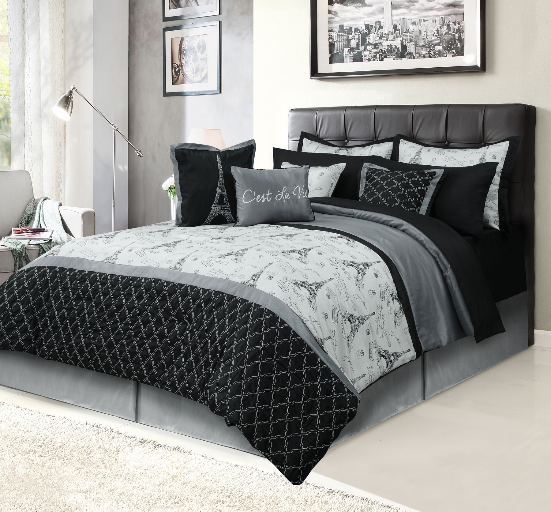 An image of a 12-piece bedding set that includes one comforter, two shams, four decorative pillows, a four-piece sheet set, and a bed skirt