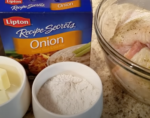 A box of Lipton&#x27;s Recipe Secrets onion soup mix next to uncooked meat, flour, and butter