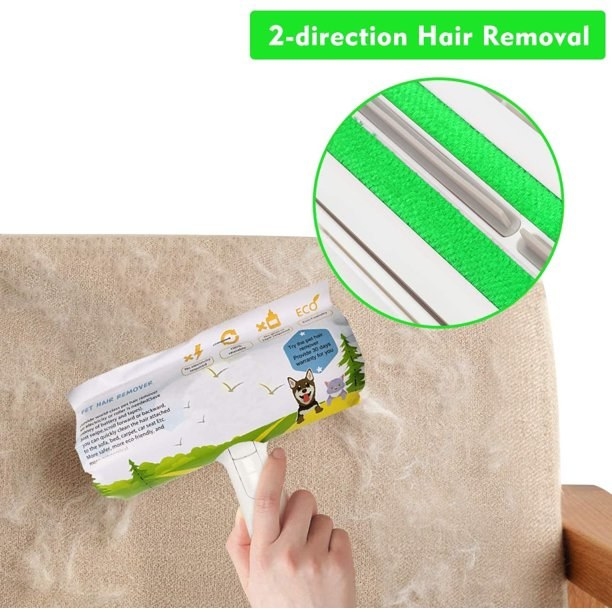 The remover wand being rolled on a couch to trap and remove hair