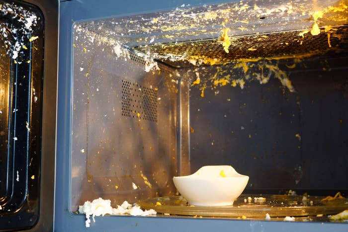 Eggs splattered all over the inside of a microwave