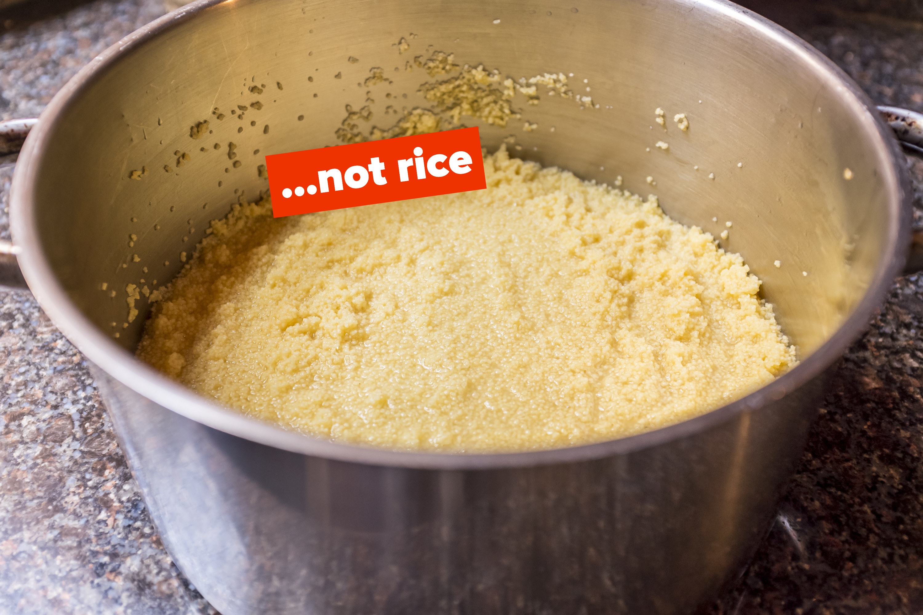 A pot of couscous with the words &quot;not rice&quot; next to it