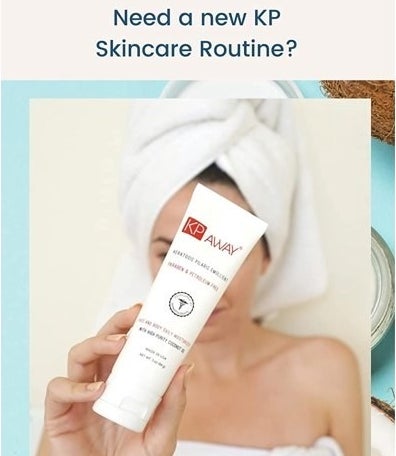 Model wearing towel on body and head holding the bottle of lotion in front of her face