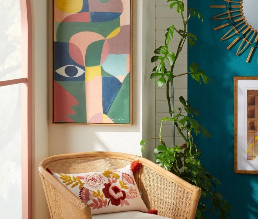 Throw pillow on arm chair in boho designed room.