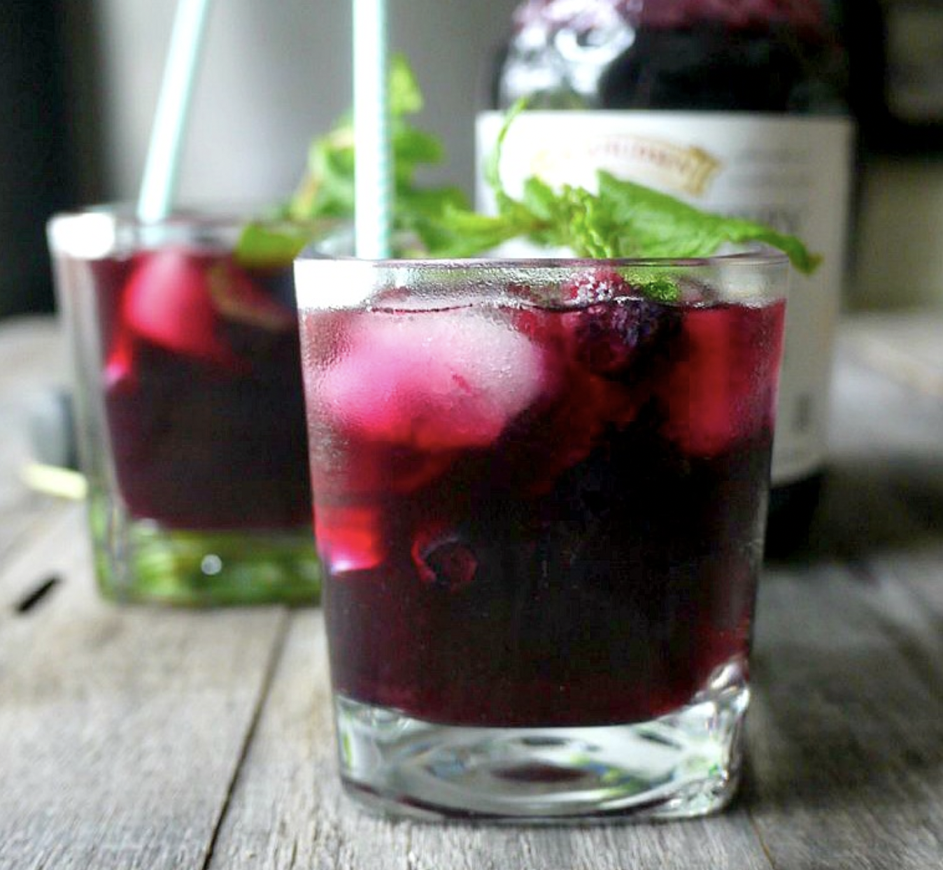 A glass of blueberry maple mojito mocktail