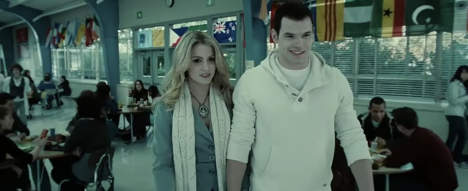 Emmett Cullen and Esme walking through the cafeteria