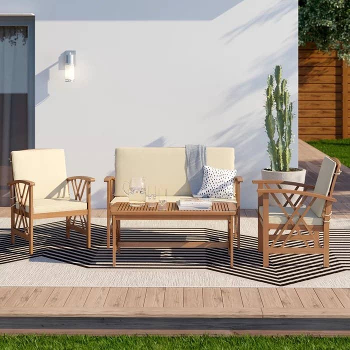 wooden patio furniture with beige cushions