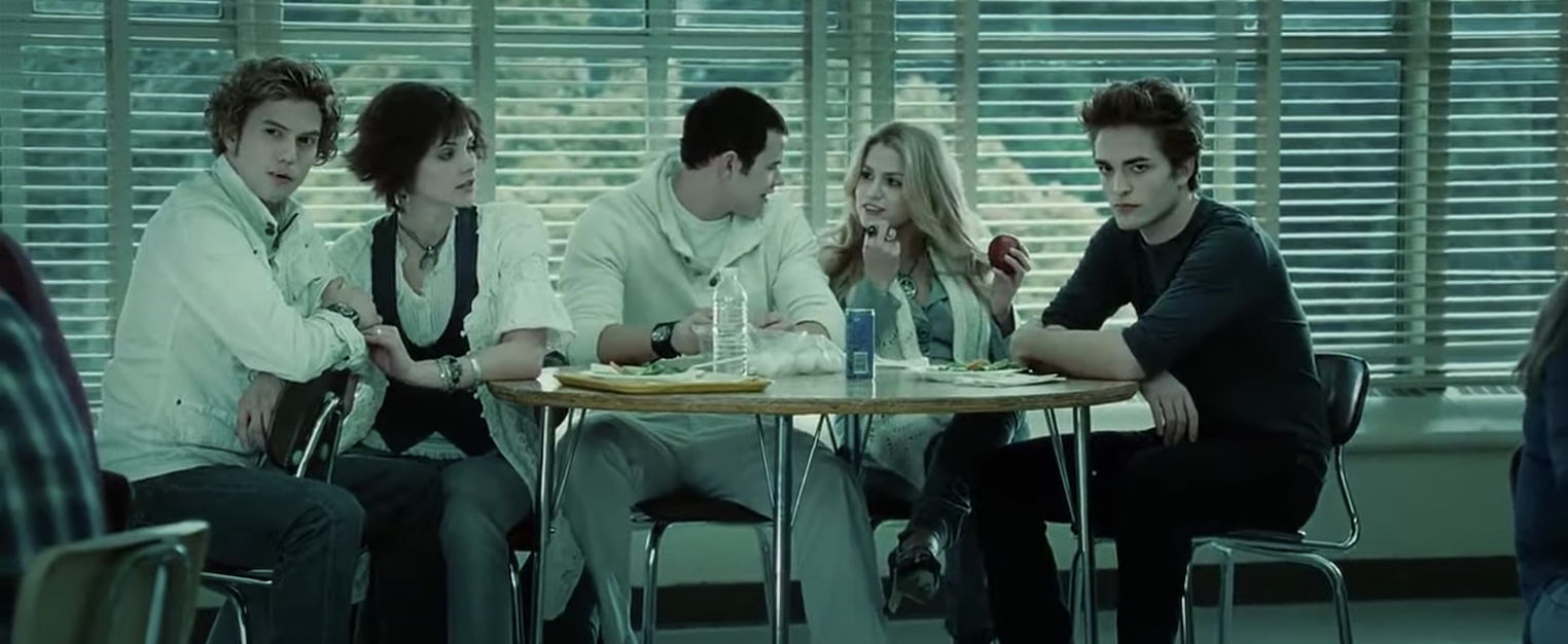 the Cullen gang sitting together in the cafeteria
