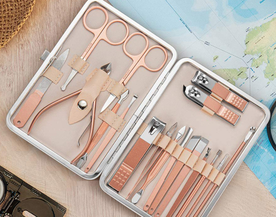 a rose gold manicure kit with various tools