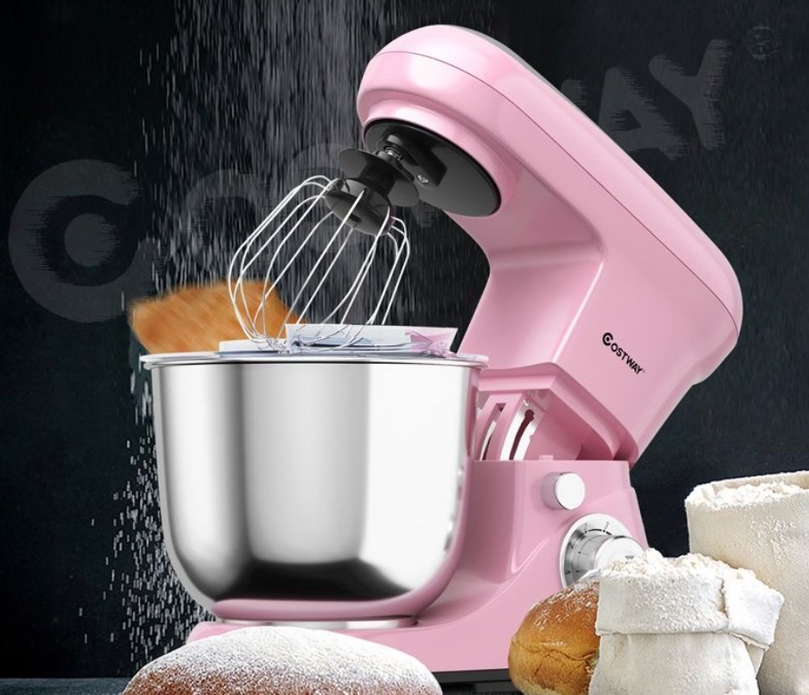 Pink standing mixer in use