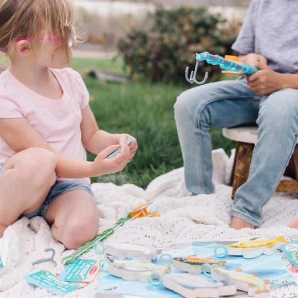 Kids playing with fishing kit